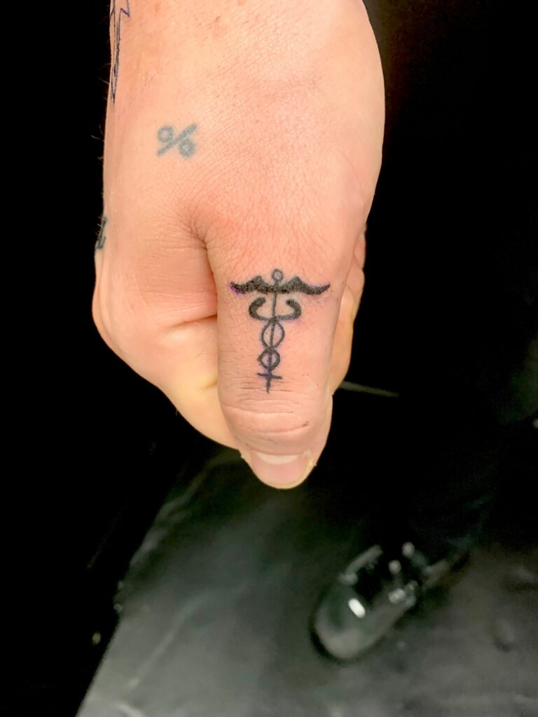 Arrow Finger Black And White Tattoo